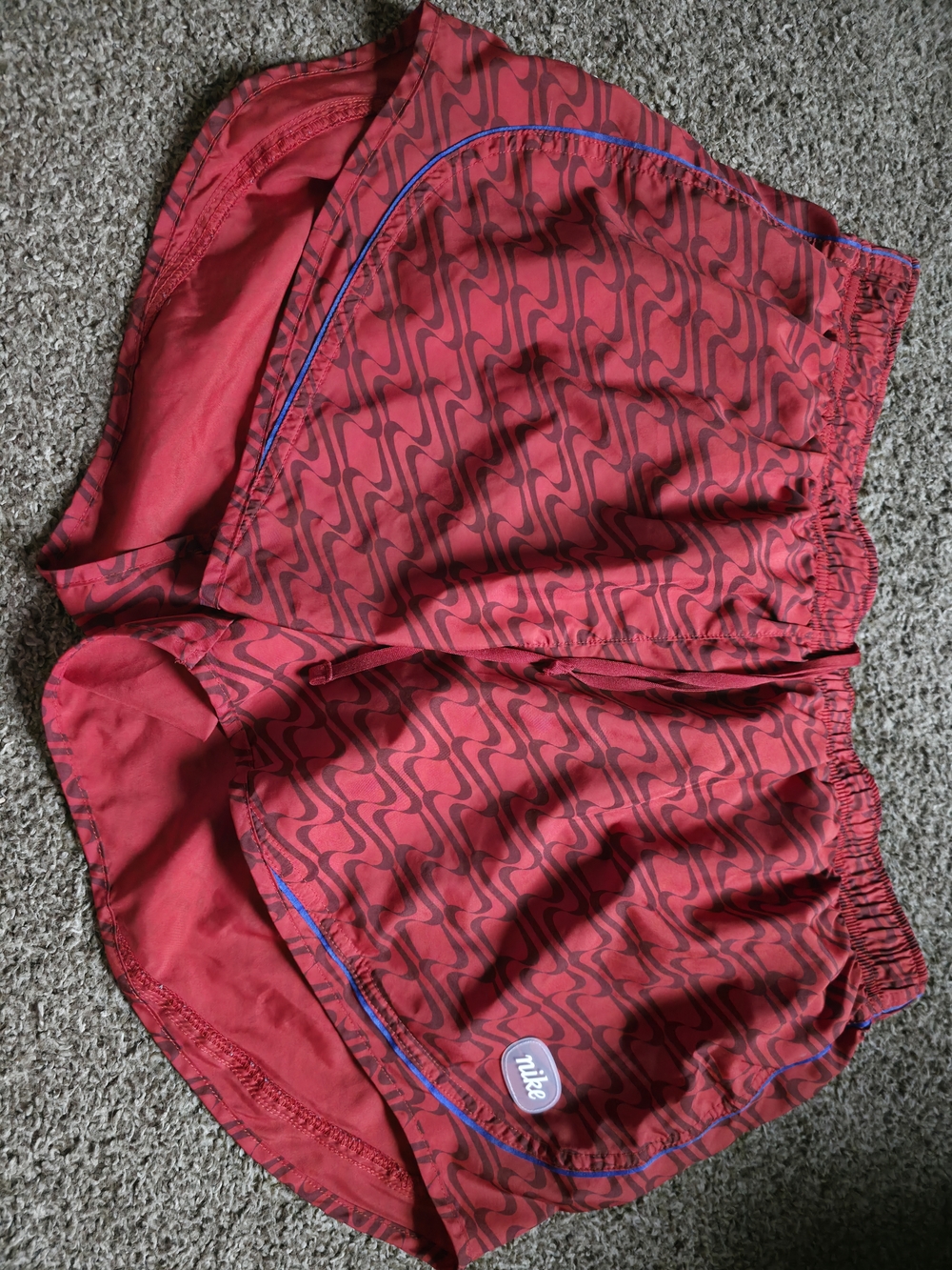 Nike Women's Red Patterned Athletic Shorts with Blue Trim